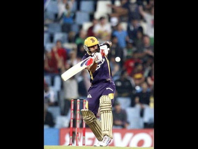 Kolkata Knight Riders's Manoj Tiwary plays a shot from Delhi Daredevils's Umesh Yadav, unseen, during the Champions League Twenty20 cricket match at the Centurion Park in Pretoria. AP Photo