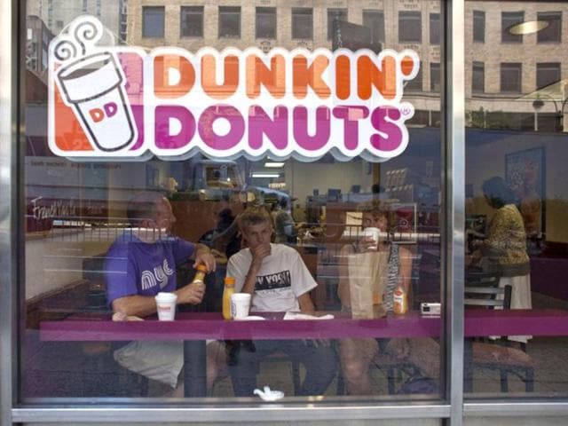 File photo of customers at a Dunkin' Donuts store in midtown Manhattan in the New York City. Ramin Talaie/Getty Images/AFP
