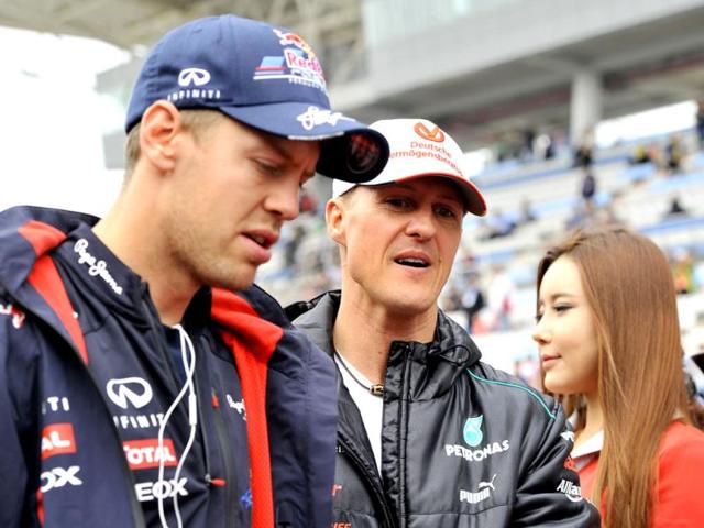 Mercedes-AMG-driver-Michael-Schumacher-of-Germany-talks-to-Red-Bull-Renault-driver-Sebastian-Vettel-of-Germany-as-they-attend-a-drivers-track-parade-at-the-Korean-circuit-ahead-of-the-start-of-the-Formula-One-Korean-Grand-Prix-in-Yeongam-AFP-Jung-Yeon-Je Mercedes-AMG-driver-Michael-Schumacher-of-Germany-talks-to-Red-Bull-Renault-driver-Sebastian-Vettel-of-Germany-as-they-attend-a-drivers-track-parade-at-the-Korean-circuit-ahead-of-the-start-of-the-Formula-One-Korean-Grand-Prix-in-Yeongam-AFP-Jung-Yeon-Je