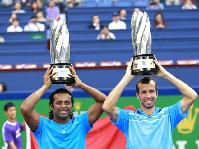 Leander Paes and Radek Stepanek hold the champion trophies during the award ceremony of the men's doubles final of at the Shanghai Masters tennis tournament at Qizhong Forest Sports City Tennis Center in Shanghai, China. Paes and Stepanek pair won over Mahesh Bhupathi and Rohan Bopanna 6-7(7), 6-3, 10-5. AP/Eugene Hoshiko