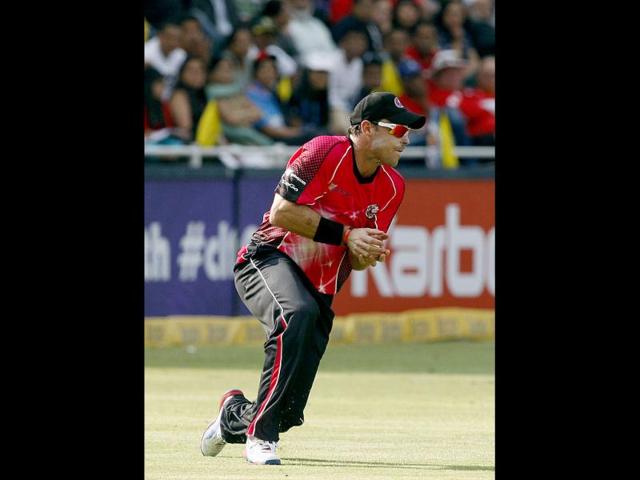 Sydney Sixers' fielder Michael Lumb takes a catch to dismiss Chennai Super Kings's batsman Michael Hussey during the Champions League Twenty20 cricket match at the Wanderers Stadium, Johannesburg. AP photo