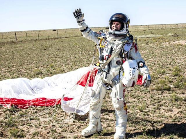 In this photo provided by Red Bull Stratos, Felix Baumgartner celebrates after successfully completing the final manned flight for Red Bull Stratos. AP/Red Bull Stratos, Balazs Gardi