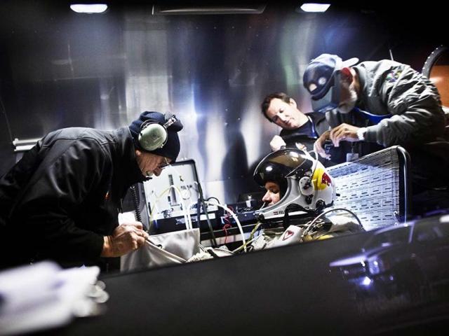 This picture provided by www.redbullcontentpool.com shows, Felix Baumgartner preparing in his trailer during the final manned flight for Red Bull Stratos in Roswell, New Mexico. AFP/Red Bull Handout