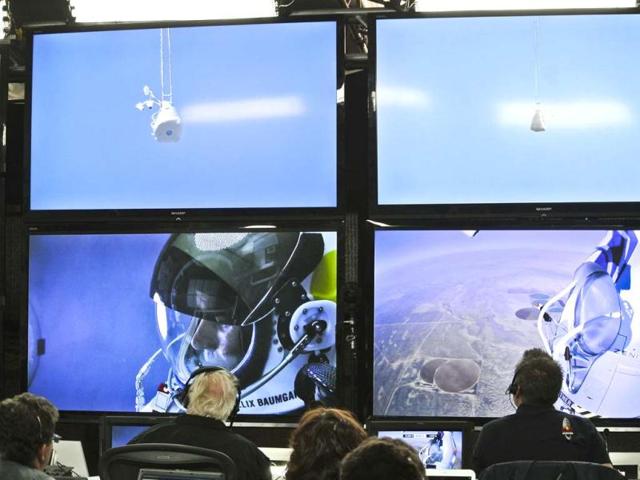 In this photo provided by Red Bull, Felix Baumgartner is seen in a screen at mission control center in the capsule during the final manned flight for Red Bull Stratos in Roswell, New Mexico. AP/Red Bull Stratos