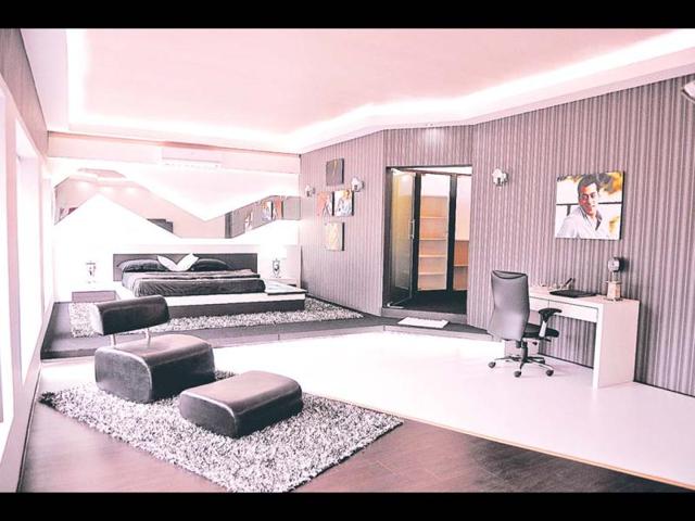 The bedroom has huge double bed with black satin sheets. The lighting in the bedroom is soft to complement Salman’s mood.