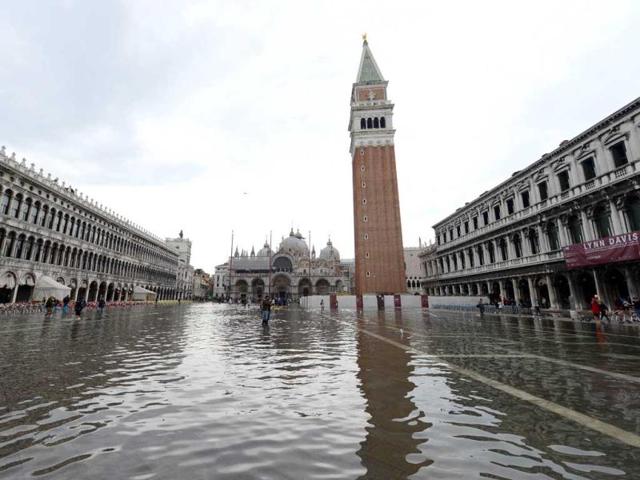 Flooded St Mark's square during the first "acqua alta" of the season in Venice. The "acqua alta", a convergence of high tides and a strong sirocco, reached 105 centimeters. AFP photo