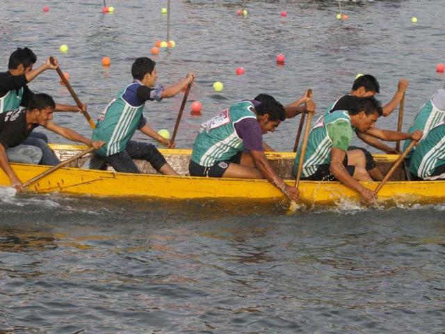 Youngsters row during the inauguration of a week long water sports games event - "Jashan-e-Dal" on the Dal Lake in Srinagar. AP photo