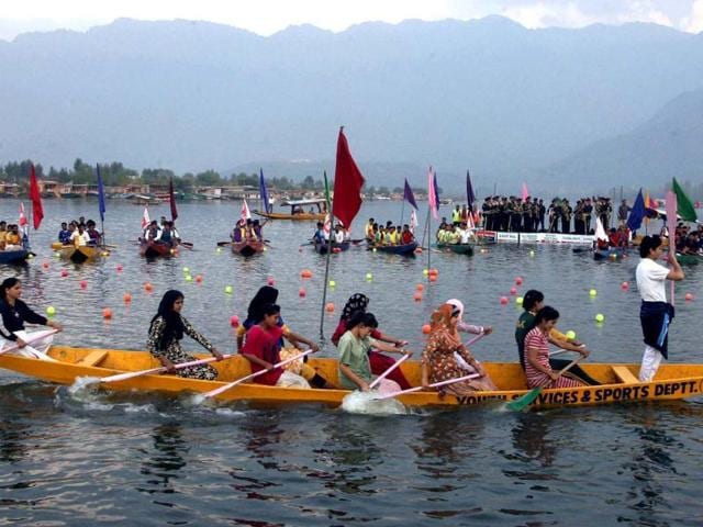 Girls perform in a boat during the inaugural ceremony of "Jashan-e-Dal" at Dal Lake in Srinagar. PTI Photo