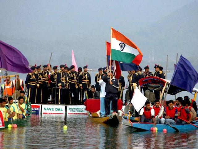 Participants perform in a boat during the inaugural ceremony of "Jashan-e-Dal" at Dal Lake in Srinagar. Jammu and Kashmir Police opened "Jashan-e-Dal", a three-day long water sports event to encourage the younger generation of troubled Kashmir towards water sports. PTI Photo