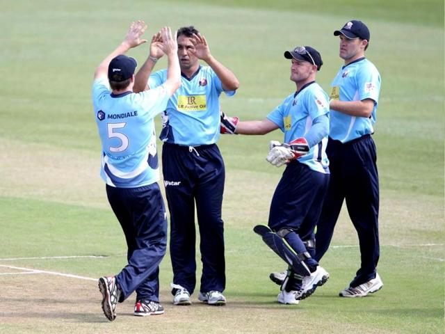 Players of the Auckland Aces celebrate a wicket during the Champions League T20 (CLT20) cricket match between the Nashua Titans (South Africa) and the Auckland Aces (New Zealand) at the Sahara Park Kingsmead in Durban . AFP PHOTO/STR