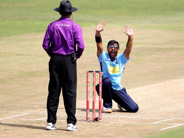 Roneel Hira (R) of the Auckland Aces appeals for a wicket during the Champions League T20 (CLT20) cricket match between the Nashua Titans (South Africa) and the Auckland Aces (New Zealand) at the Sahara Park Kingsmead in Durban on . AFP PHOTO/ STR