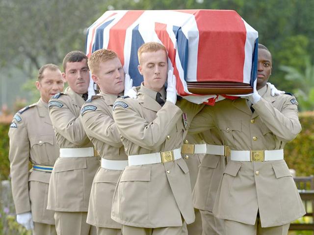 British Royal Air Force officers carry a coffin with the remains of eight World War II crew members of the RAF Liberator KL654 aircraft during a reburial ceremony in Kuala Lumpur. AFP photo