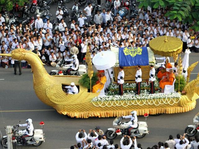 A phoenix float with the casket carrying the body of former Cambodian King Norodom Sihanouk proceeds as mourners line up a street to pay their respects in Phnom Penh, Cambodia. AP Photo