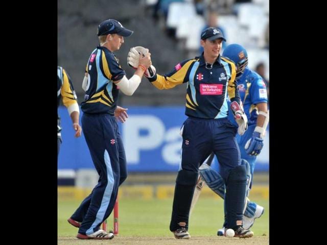 Dan Hodgson of Yorkshire Carnegie celebrates after stumping Sachin Tendulkar of the Mumbai Indians during Match 11 of The Champions League T20 (CLT20) between the Mumbai Indians (India) and Yorkshire (England) at Newlands Cricket Stadium in Cape Town. AFP Photo/Luigi Bennett