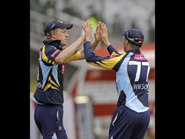 Yorkshire's Steven Patterson, left, reacts with a team mate as Mumbai Indians' Dwayne Smith, unseen, loses his wicket during the Champions League Twenty20 in Cape Town, South Africa. AP Photo/Schalk van Zuydam