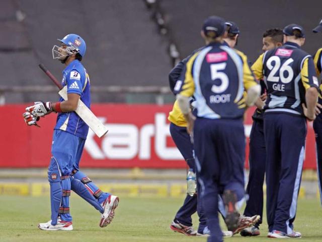 Mumbai Indians Rohit Sharma, left, walks of the field after he lost his wicket against Yorkshire during the Champions League Twenty20 in Cape Town. AP Photo/Schalk van Zuydam