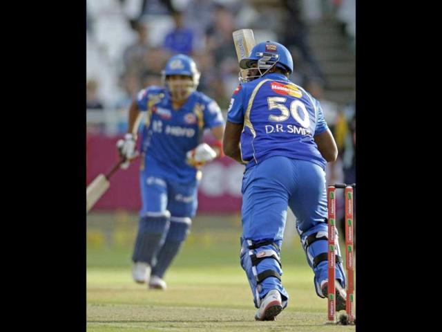 Mumbai Indians Dwayne Smith, right, makes a run against Yorkshire during the Champions League Twenty20 in Cape Town. AP Photo/Schalk van Zuydam