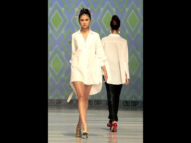 Models display creations by Colombian designer Julieta Suarez at the Cali Exposhow fashion week in Cali, Colombia. AP photo