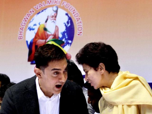 Urban Poverty Alleviation Minister Kumari Selja chats with Aamir Khan at the event. (PTI Photo)