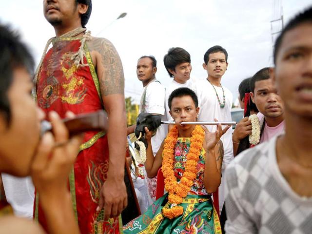 Devotees of Ban Tha Rua Chinese shrine take part in a procession celebrating the annual vegetarian festival in Phuket. (Reuters/Damir Sagolj)