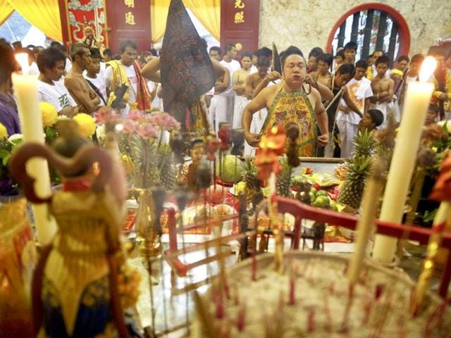 Devotees of Ban Tha Rua Chinese shrine get into a trance as they prepare for a procession celebrating the annual vegetarian festival in Phuket. (Reuters/Damir Sagolj)