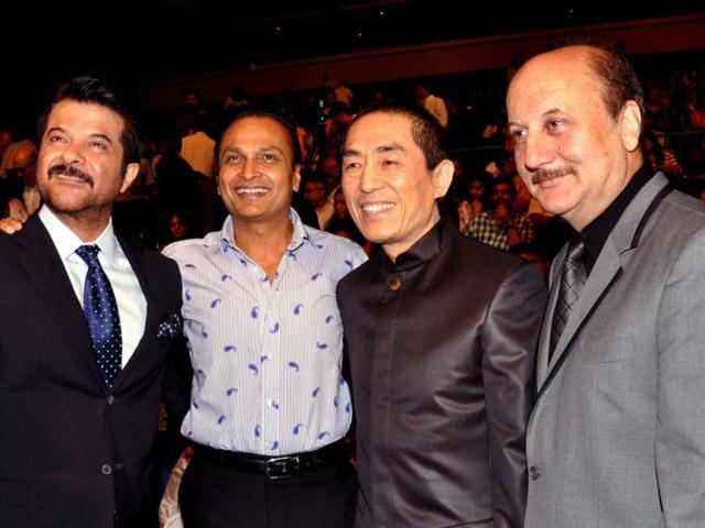 Bollywood-actors-Anil-Kapoor-L-and-Anupam-Kher-R-pose-with-industrialist-Anil-Ambani-2L-and-Chinese-Director-Zhang-Yimou-2R-as-they-attend-the-opening-ceremony-for-the-14th-Mumbai-Film-Festival-in-Mumbai-late-October-18-2012-AFP-PHOTO Bollywood-actors-Anil-Kapoor-L-and-Anupam-Kher-R-pose-with-industrialist-Anil-Ambani-2L-and-Chinese-Director-Zhang-Yimou-2R-as-they-attend-the-opening-ceremony-for-the-14th-Mumbai-Film-Festival-in-Mumbai-late-October-18-2012-AFP-PHOTO