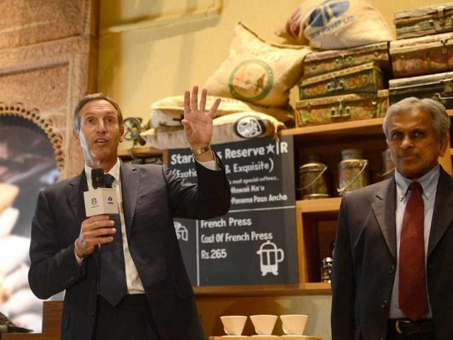 Starbucks Coffee Company's chairman Howard Schultz speaks as vice chairman of Tata Global Beverages RK Krishnakumar watches during a news conference at the country's first newly-inaugurated Starbucks outlet in Mumbai. AFP/Punit Paranjpe