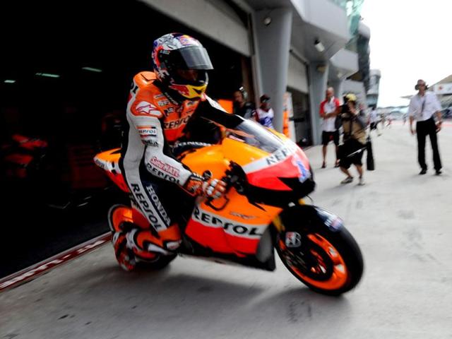 Honda rider Casey Stoner of Australia leaves his pit during the third practice session of the Malaysian Grand Prix MotoGP motorcycling race at Sepang circuit. AFP photo