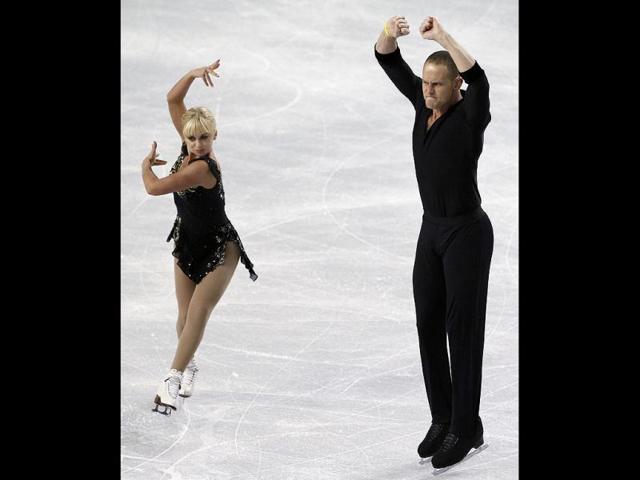 Caydee Denney and John Coughlin skate during the pairs short program in the Skate America figure skating event in Kent, Washington. AP photo