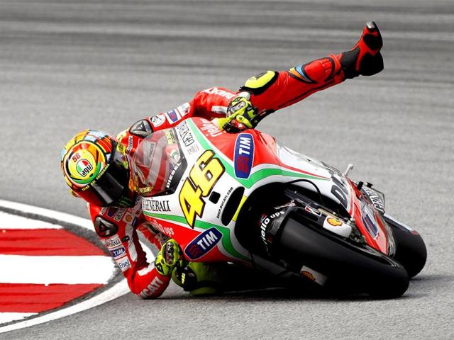 Italy's Valentino Rossi falls off his Ducati during the MotoGP free practice session at the Malaysian Motorcycle Grand Prix in Sepang, Malaysia. AP photo