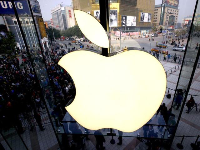 Members of the public enter a new Apple store during the official opening in Beijing's Wangfujing shopping district. The store is Apple's fifth in mainland China, as is being promoted as the largest in Asia. Reuters