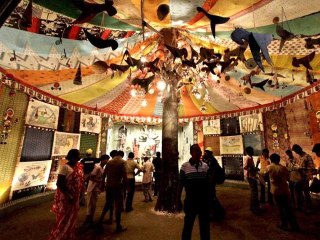 Devotees visit a pandal or a marquee on the first day of the Durga Puja festival in Kolkata. AP/Bikas Das