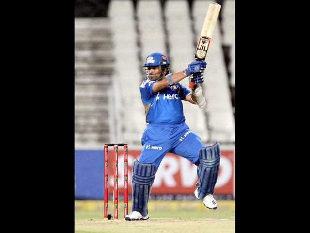 Mumbai Indians batsman Sachin Tendulkar takes a shot during their Champions League Twenty20 cricket match against Chennai Super Kings at the Wanderers Stadium in Johannesburg. AP Photo/Themba Hadebe