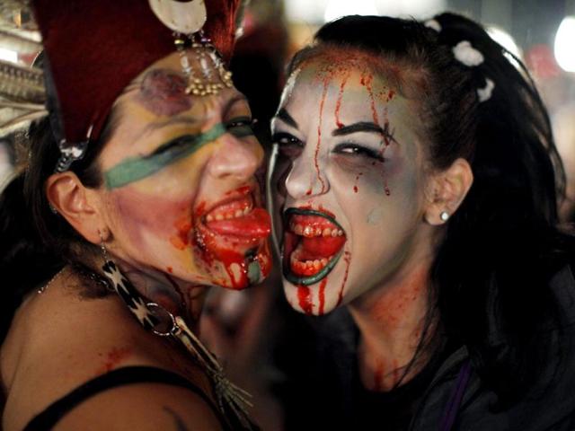 Women dressed up as zombies pose for a picture during an event in New York. Hundreds of people took part in the event known as "Zombiecon" during Halloween celebrations, and to pay homage to the character typically depicted in popular culture as the mindless walking dead with a penchant for human flesh and brains. Reuters
