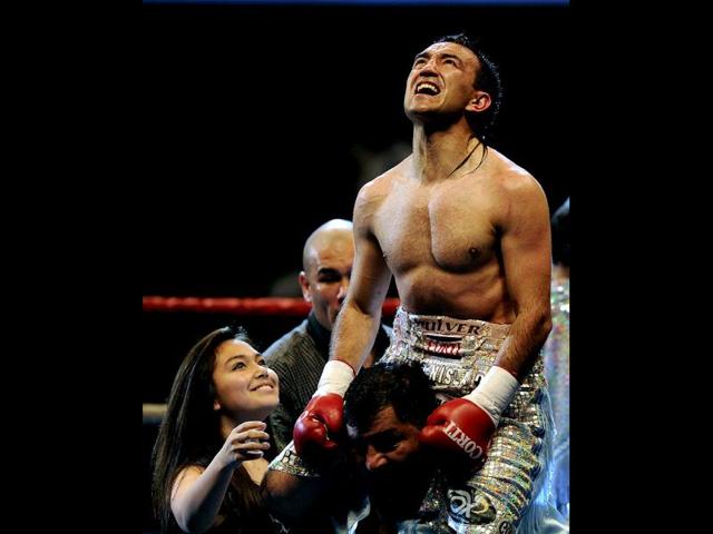 Argentinian World Boxing Organization super-flyweight champion Omar Narvaez celebrates after defeating Mexican Johnny Garcia during their WBO super-flyweight world championship fight in Buenos Aires.AFP photo