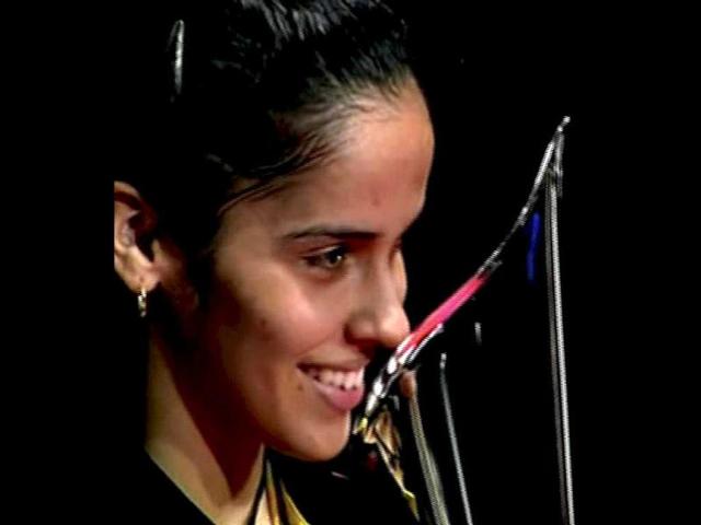 Saina Nehwal holds the trophy after winning the Denmark Open woman's single final badminton match against Juliane Schenk of Germany in Odense, Denmark. PTI Photo