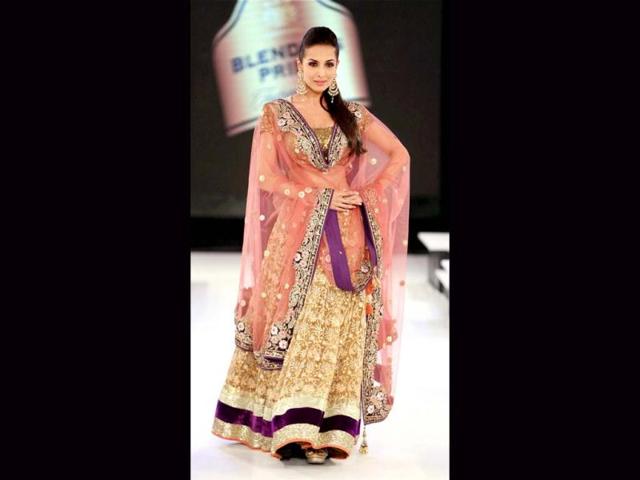 Malaika looked stunning in the golden, purple and peach lehenga choli as she walked the ramp at Blenders Pride Fashion Tour.
