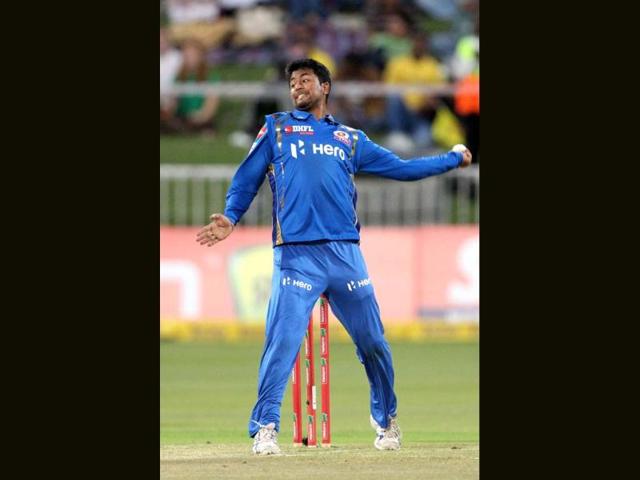 Pragyan Ojha of the Mumbai Indians bowls on during a Champions League T20 (CLT20) match Sydney Sixers vs Mumbai Indians at Sahara Stadium Kingsmead in Durban. AFP Photo