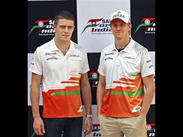 Force India Formula One team Nico Hulkenberg of Germany, right, and Paul Di Resta of Britain pose for a photo before a press conference, in New Delhi. AP Photo/Manish Swarup