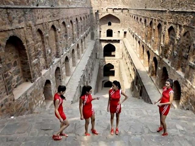 Indian Formula One grid girls prepare for a photocall during a promotional event ahead of the Indian Formula One Grand Prix, in New Delhi. The grand prix is scheduled to be held Oct 26-28. AP Photo/Altaf Qadri
