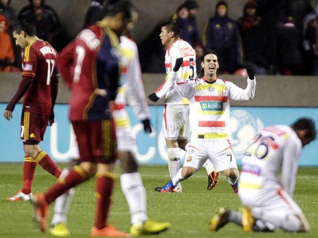 CS Herediano's Yendrick Ruiz (7) celebrates as Real Salt Lake players walk by following their CONCACAF soccer match in Sandy, Utah. The game ended in a 0-0 tie. AP Photo