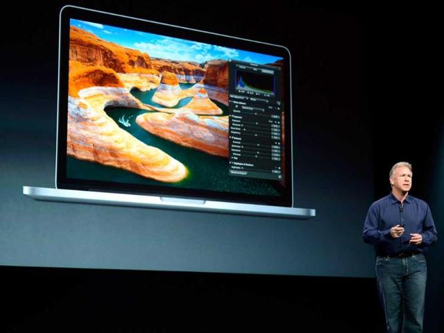 Apple Senior Vice President of Worldwide product marketing Phil Schiller announces the new 13-inch MacBook Pro during an Apple special event at the historic California Theaterin San Jose, California. Apple is expected to introduce a smaller, less expensive version of the iPad. Getty Images/AFP