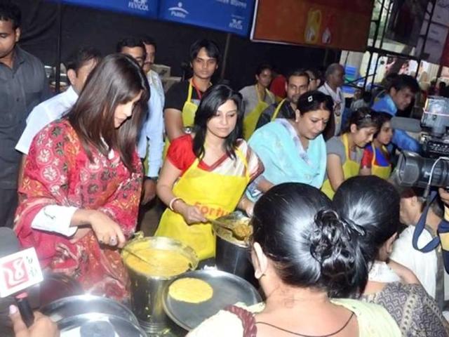 "Priyanka serving Ashtami bhog at my Pujo pandal," tweeted Abhijeet.
