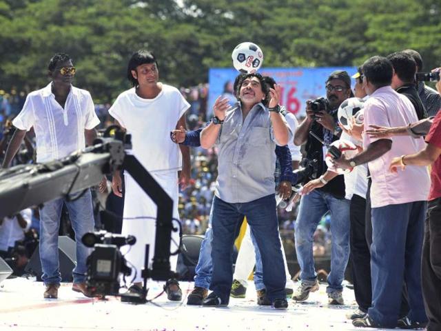 Argentine soccer legend Diego Maradona, center, entertains fans in Kannur, Kerala. Maradona arrived on a two-day private visit. (AP Photo)
