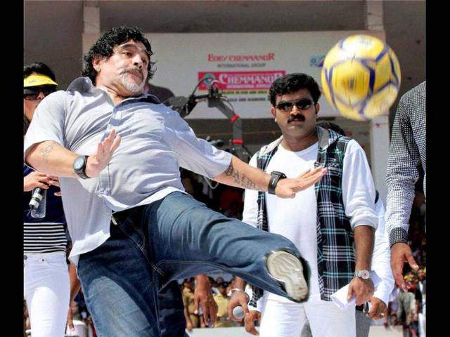 Footballer Diego Armando Maradona shows his skills at a function at Jawahar Stadium in Kannur. PTI Photo