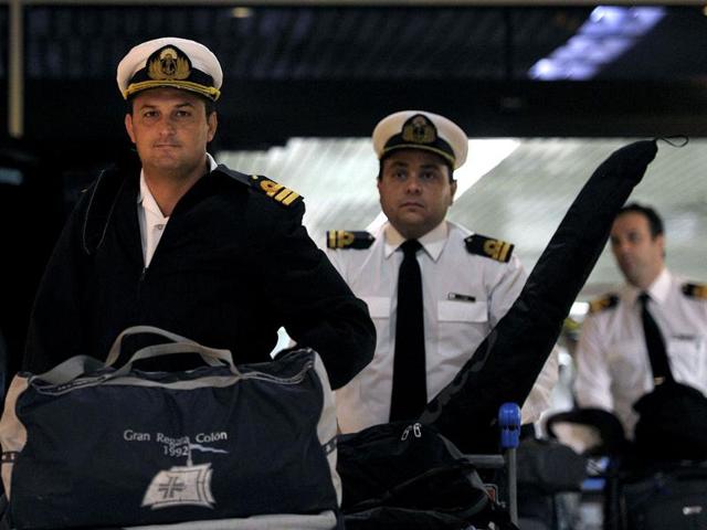 Crew members of the Argentine frigate ARA Libertad arrive to Ezeiza's International airport in Buenos Aires, Argentina, after being stuck in Ghana for more than three weeks since a court detained their ship over a debt dispute. AFP PHOTO/ Juan Mabromata