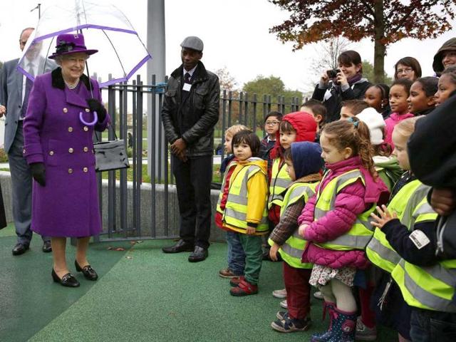 Britain's Queen Elizabeth looks at school children in a playground at the opening of the recently re-built Jubilee Gardens in London. Reuters/Peter Macdiarmid