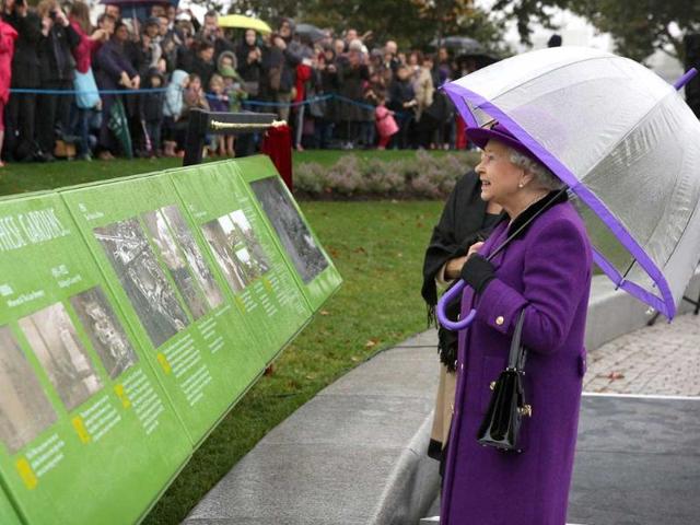 Queen Elizabeth II attends the opening of the recently re-built Jubilee Gardens in London. The recent transformation of the Jubilee Gardens was completed 35 years after they were first created in 1977 to celebrate the Queen's silver jubilee. AFP/Peter Macdiarmid