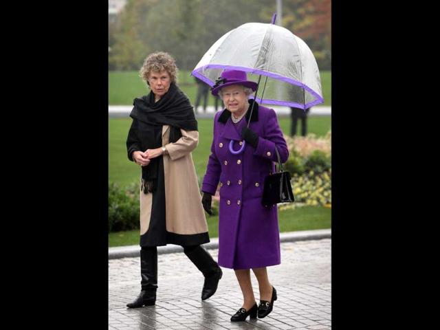 Queen Elizabeth II walks with local Member of Parliament Kate Hoey at the opening of the recently re-built Jubilee Gardens in London. AFP/Peter Macdiarmid