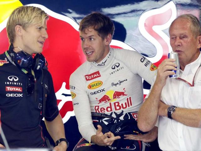 Sebastian Vettel chats with a team member during the first practice session for the Indian Formula One Grand Prix at the Buddh International Circuit in Noida. AP Photo